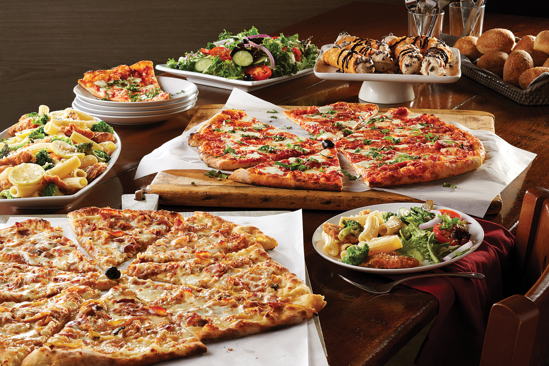 A spread of pizza and other italian foods