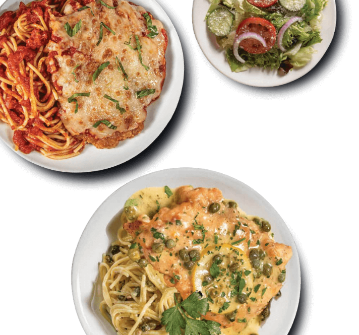 A top-down photo of two pasta dishes and a side salad